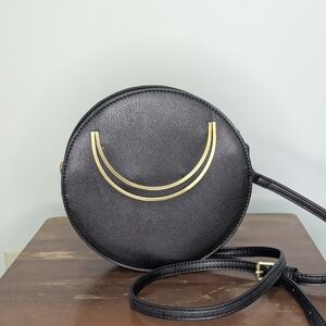 Anthropologie black and brass pebbled faux leather round evening purse